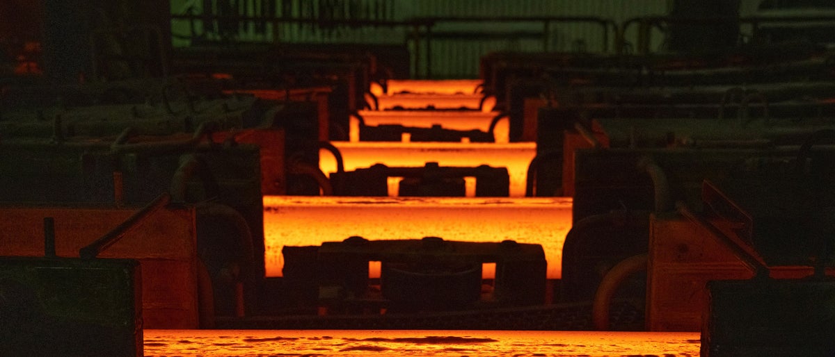 Lengths of red hot steel in a factory. Photographer: Andrey Rudakov/Bloomberg