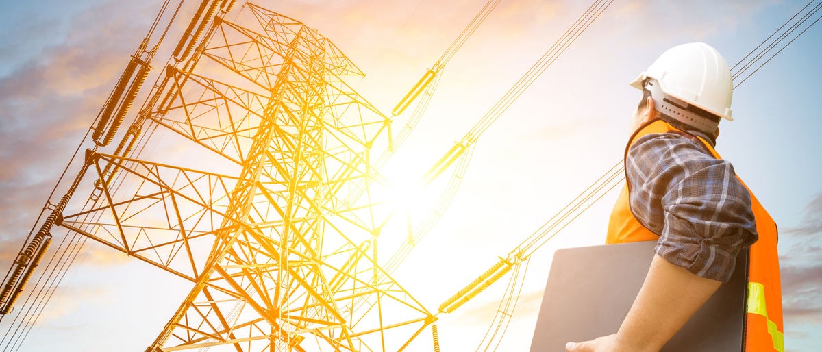 electric engineer check the high voltage pole