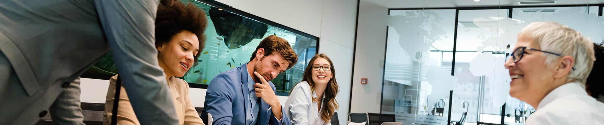 Happy business people having fun and chatting at workplace office
