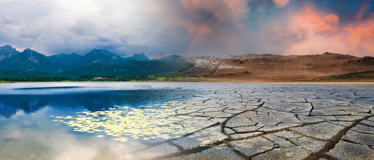 Landscape with mountains and a lake and a dried desert