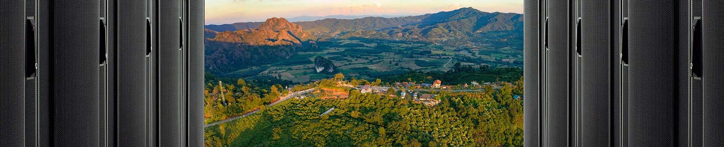Server Computer Rack in Data Center isolated on mountain background.