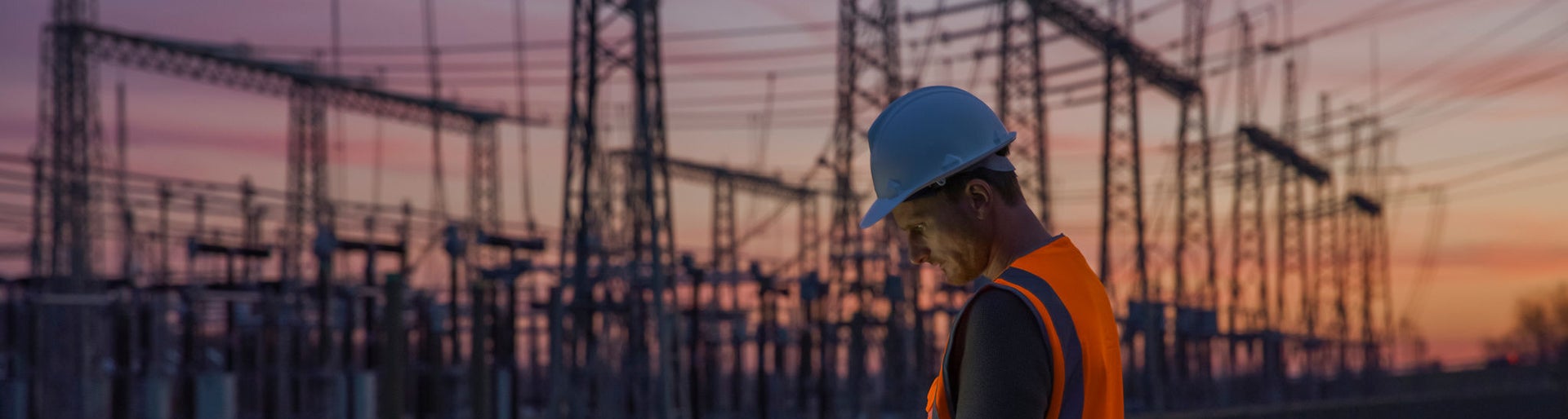 Rear view of an electrical engineer using a laptop while working