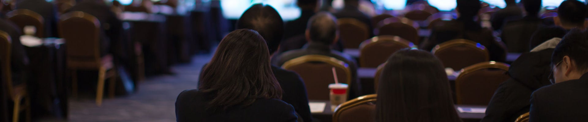 Conference Meeting Seminar Where Audience Listens to Lecturer for Training. Corporate Manager Speaker Gives Business Technology and Forecast. Group of People Hear Presenter Give Speech.