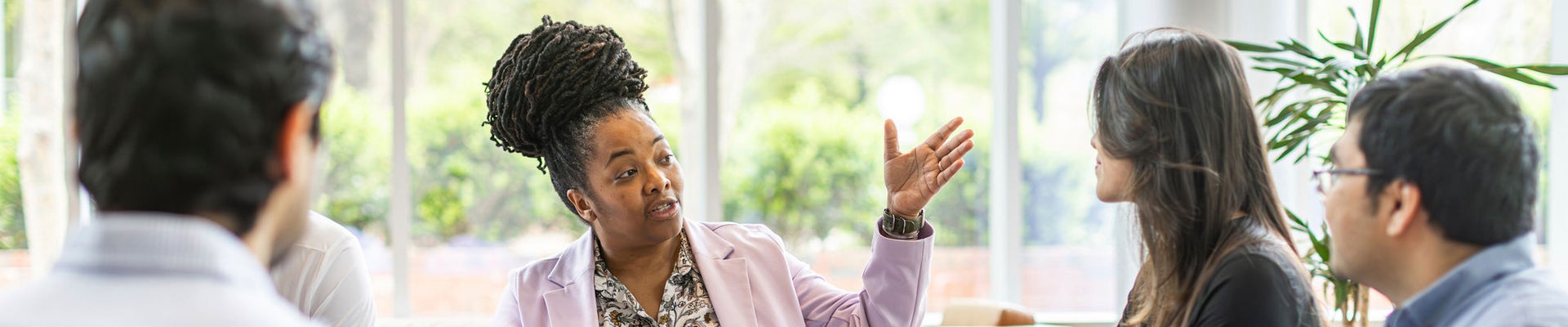 Young woman in an apron in a greenhouse conducts research into the growth of vegetables. Summer assignment for a student