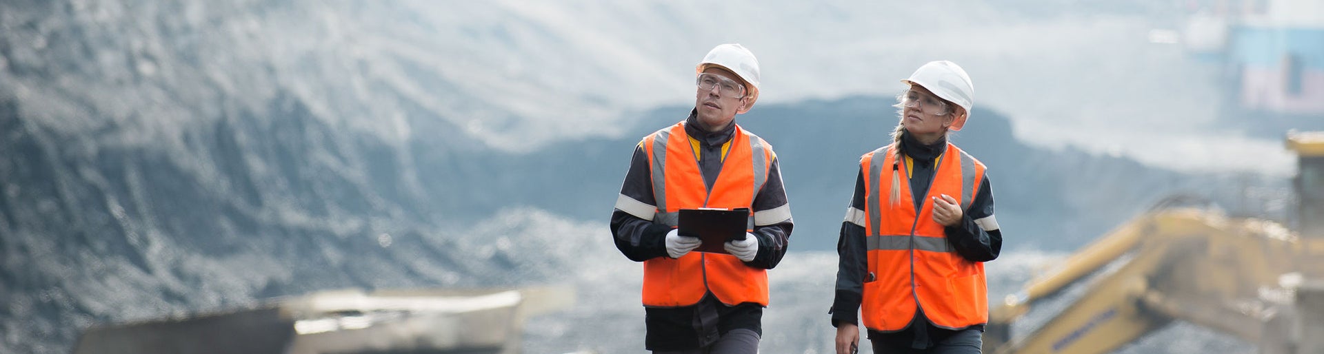 Workers with coal at open pit
