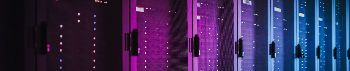 Shot of Dark Data Center With Multiple Rows of Fully Operational Server Racks. Modern Telecommunications, Cloud Computing, Artificial Intelligence, Database, Supercomputer. Pink Neon Light.