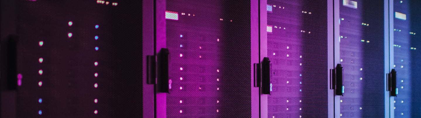 Shot of Dark Data Center With Multiple Rows of Fully Operational Server Racks. Modern Telecommunications, Cloud Computing, Artificial Intelligence, Database, Supercomputer. Pink Neon Light.