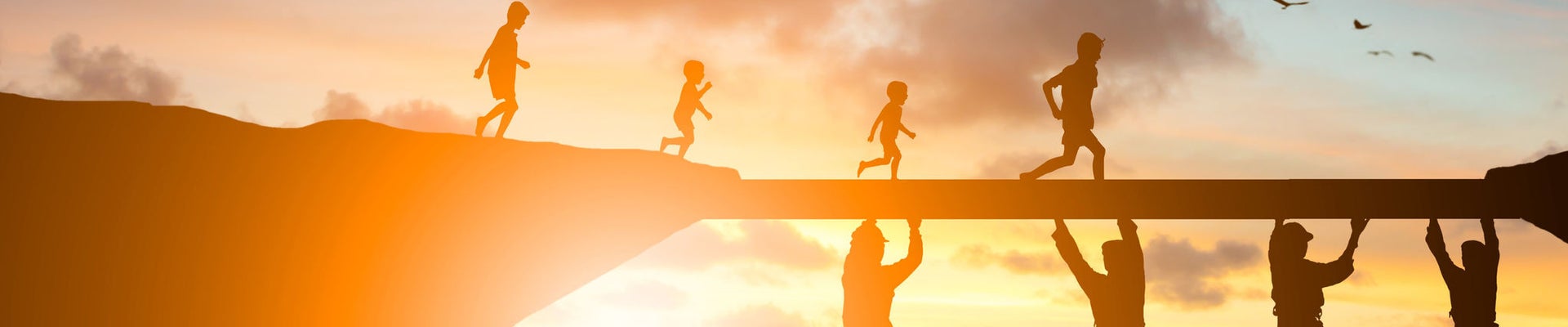 Silhouette  team responsible helped build the foundation for a child to grow up and grow efficiently over blurred natural.