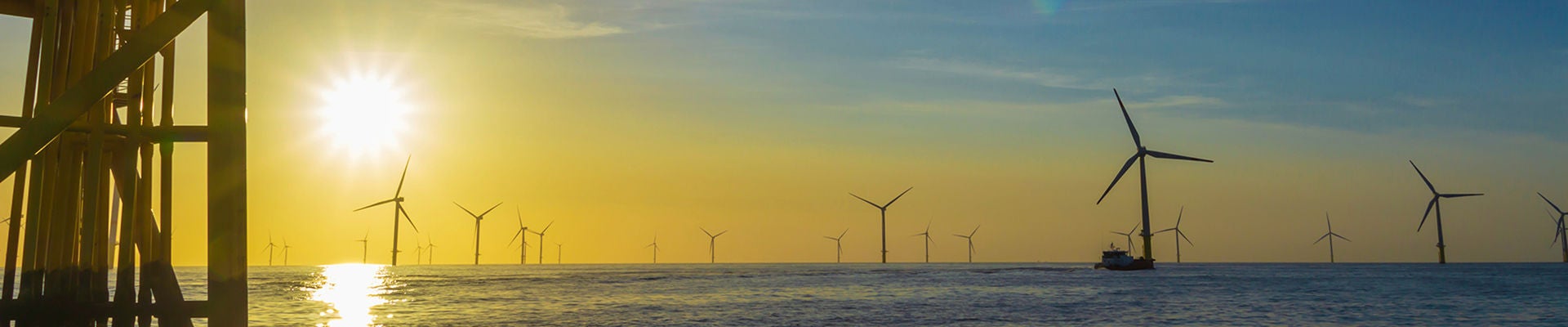 North Sea offshore wind farm substation and the sunset