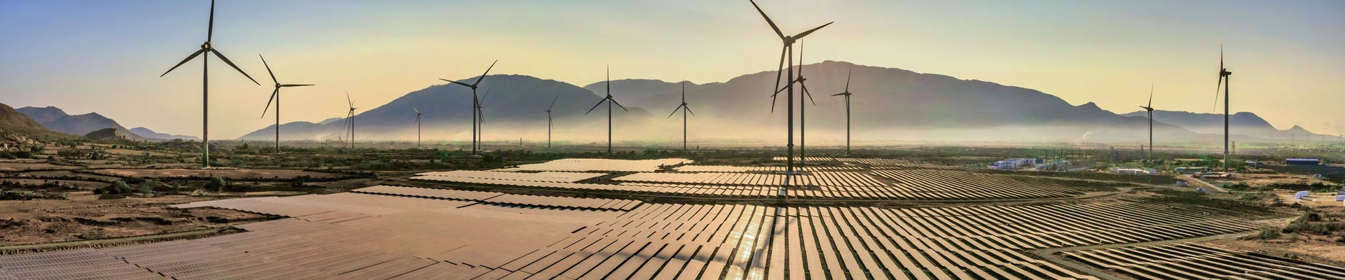Aerial view of windmill and Solar panel, photovoltaic, alternative electricity source - concept of sustainable resources on a sunny day, Bac Phong, Thuan Bac, Ninh Thuan, Vietnam