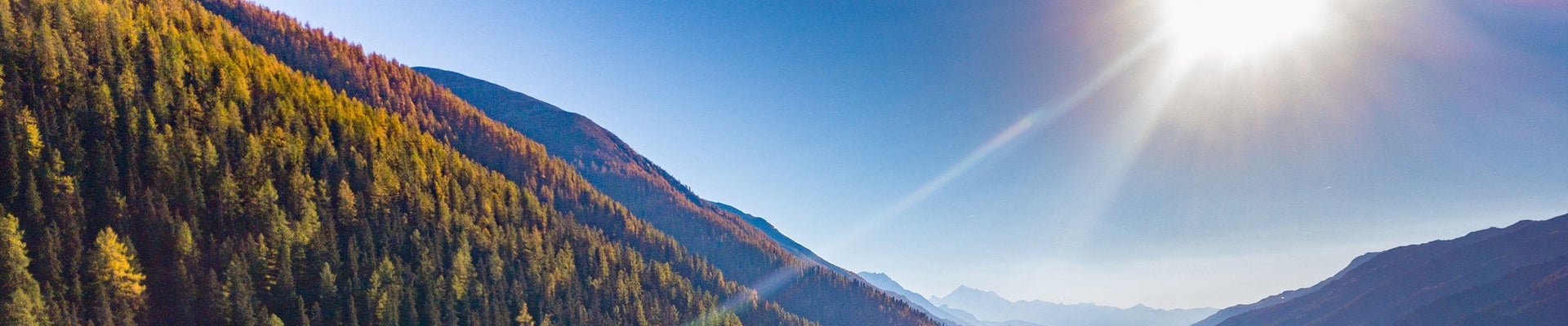 Aerial view of power line pylon in mountaineous area in Switzerland, Europe