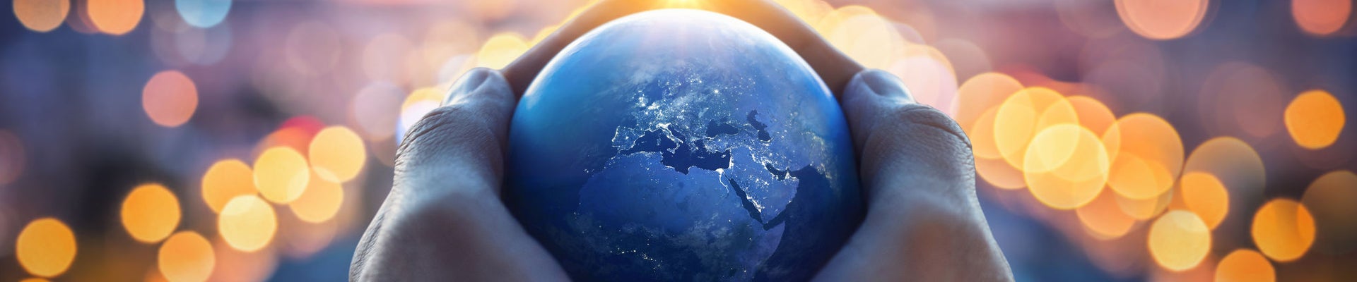 The globe Earth in the hands of man against the night city. Concept on business, politics, ecology and media. Earth day abstract background. Elements of this image furnished by NASA