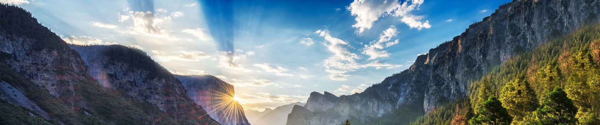 mountains with clouds and sunrise reflecting sustainable future