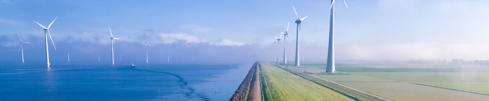 offshore windmill park with clouds and a blue sky, windmill park in the ocean aerial view with wind turbine