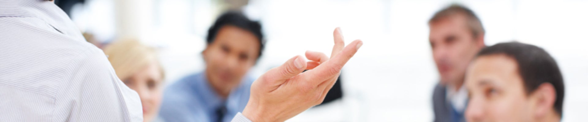 Rear view of a female executive giving her team a presentation