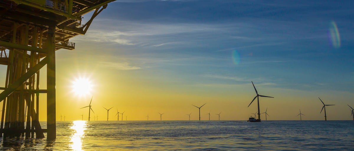 North Sea offshore wind farm substation and the sunset