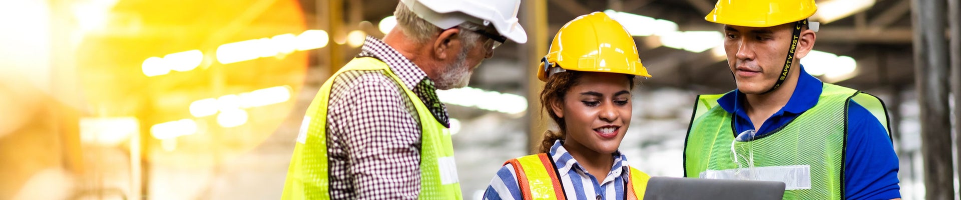 Professional Mechanical Engineer team Working on Personal Computer at Metal lathe industrial manufacturing factory. Engineer Operating  lathe Machinery. Product quality Inspection