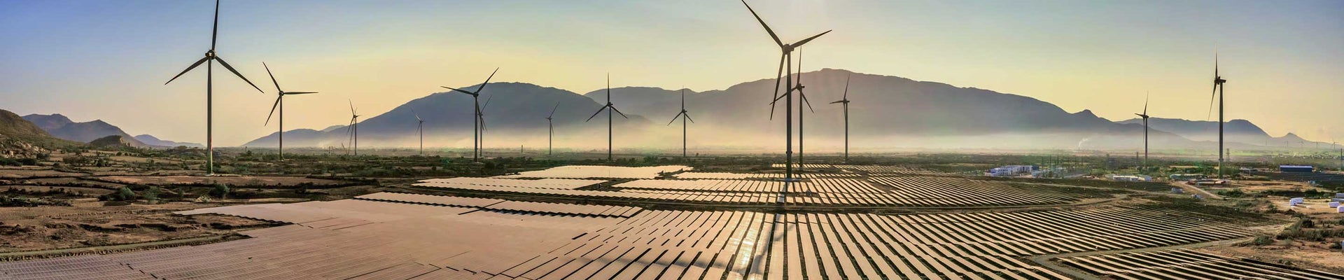 Aerial view of windmill and Solar panel, photovoltaic, alternative electricity source - concept of sustainable resources on a sunny day, Bac Phong, Thuan Bac, Ninh Thuan, Vietnam