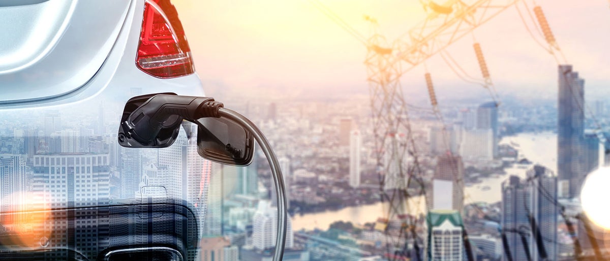 EV charging station for electric car in concept of green energy and eco power produced from sustainable source to supply to charger station in order to reduce CO2 emission .