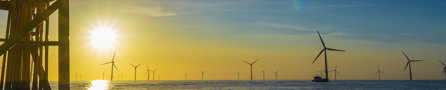 North Sea offshore wind farm substation and the sunset