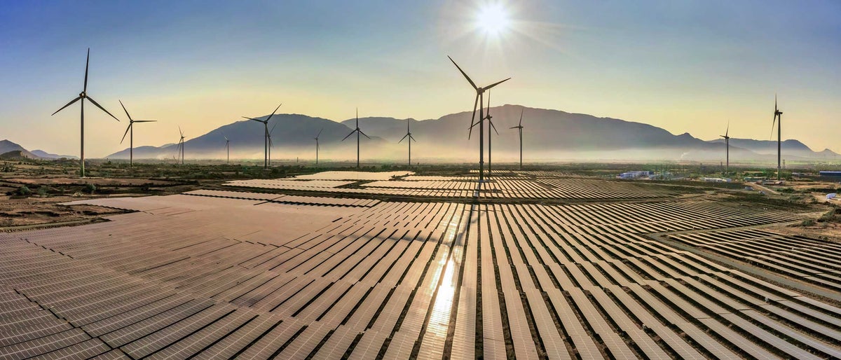 Aerial view of windmill and Solar panel, photovoltaic, alternative electricity source - concept of sustainable resources on a sunny day, Bac Phong, Thuan Bac, Ninh Thuan, Vietnam